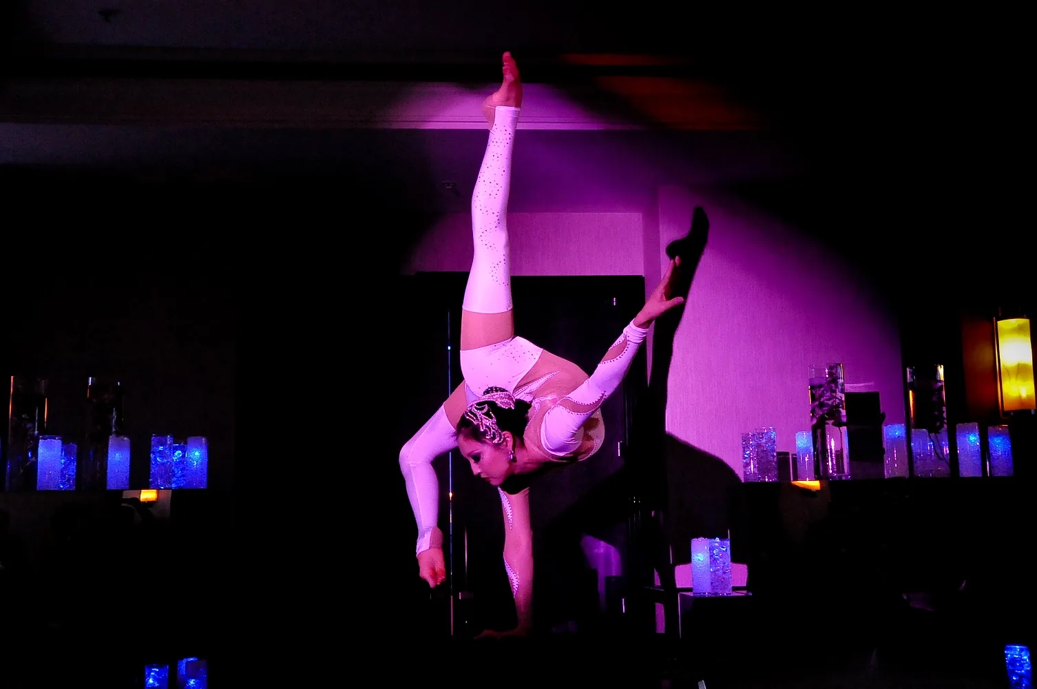 Balancing acrobat performing at a themed event